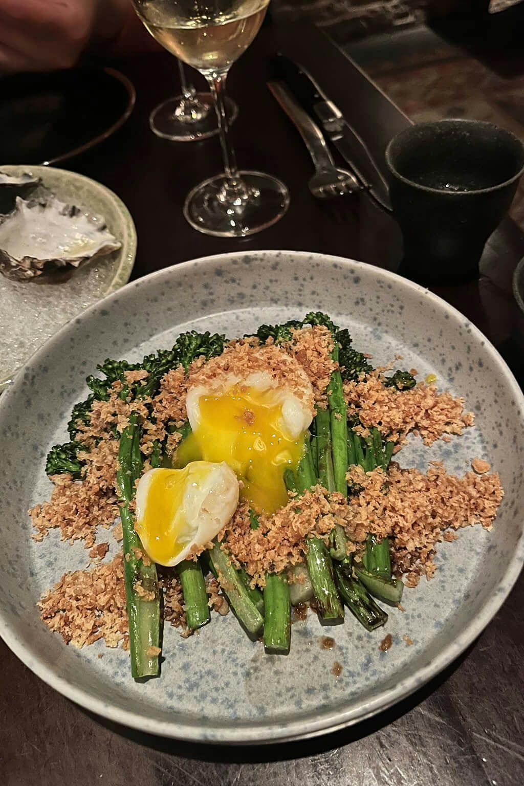 Grilled broccolini with charred soy sauce, poached egg, panko and tarragon.